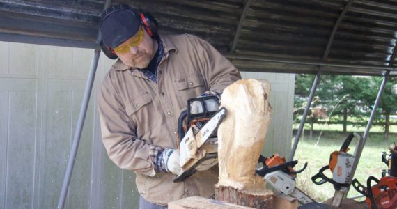 Photo by Rachel Rosen
Ted Boesch carves an owl sculpture.