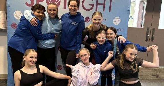 Island Dance Competition Team members celebrate their performances with a team photo. From left in front row are Emmalynn Rochholz, Maliya Thrasher and Clara Jacobson-Ross; back row shows Tay Pitts, Amelia Rochholz, Jamee Pitts (coach), Lindi Moore, Stella Jung and Lainey Dodge.