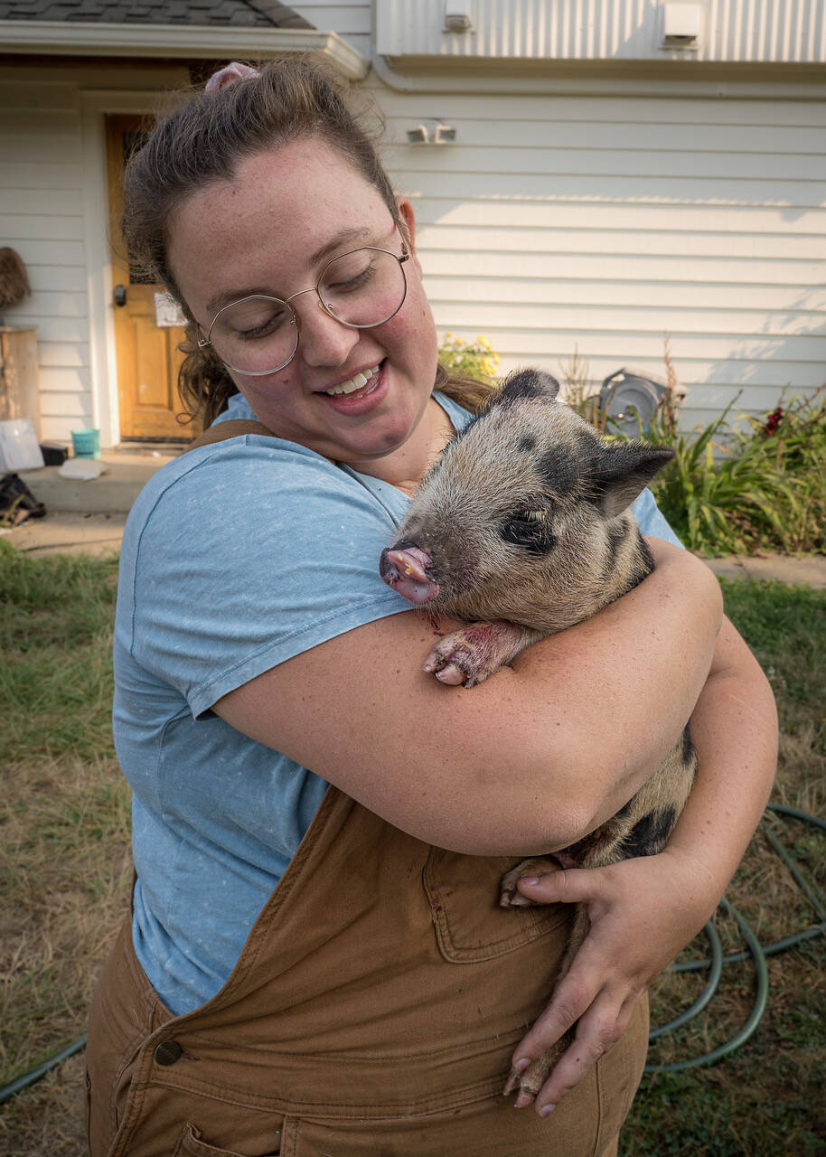 Photo by David Welton
Mackenzie Wright of Ballydidean Farm Sanctuary cuddles Petunia the pig.