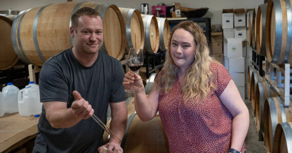 Michelle Graham samples a glass of wine. She and her husband, Kyle O’Neill, are the owners of Leo & Leto’s, formerly known as Blooms Winery. (Photo by David Welton)