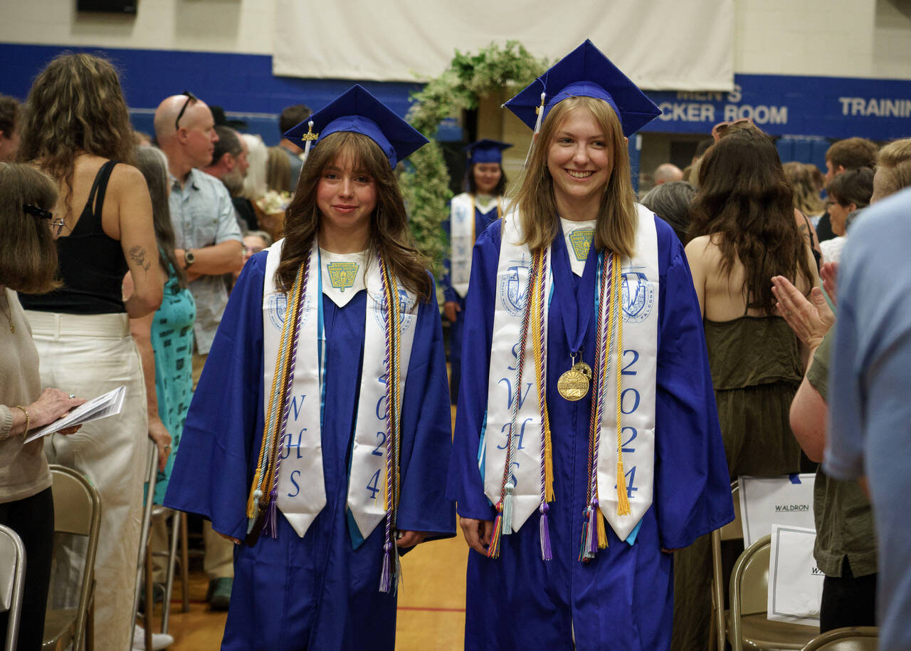 Photo by David Welton
Sophia Patrin, left, and Audrey Gmerek walk down the aisle together.