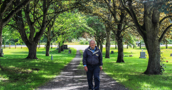 Photo by Luisa Loi
Mike Dougliss walks among the Norway maples his gran