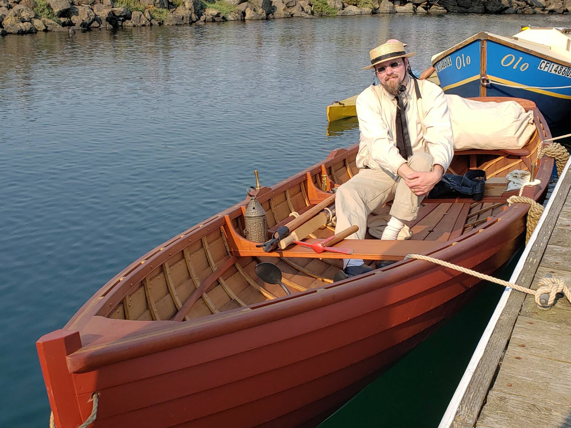 Michael Buse, a history teacher in Olympia, sits in a historical replica boat he built. (Photo provided)