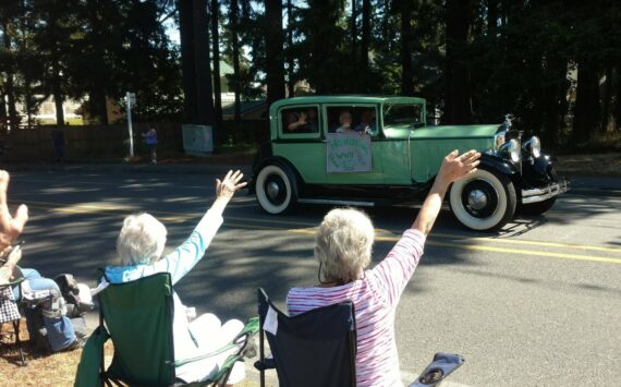 Photo provided
Onlookers wave to veterans during a previous Whidbey Island Fair parade.