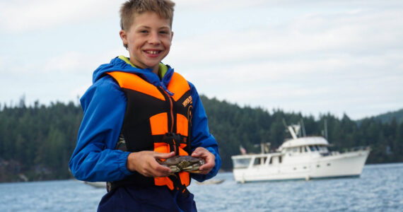 Photo by Sam Fletcher
Weston Stewart reveals his catch in Cornet Bay.