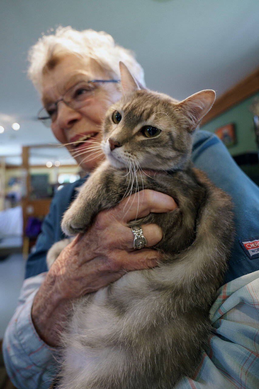 Judy Dewing cuddles handsome Lucious. (Photo by David Welton)