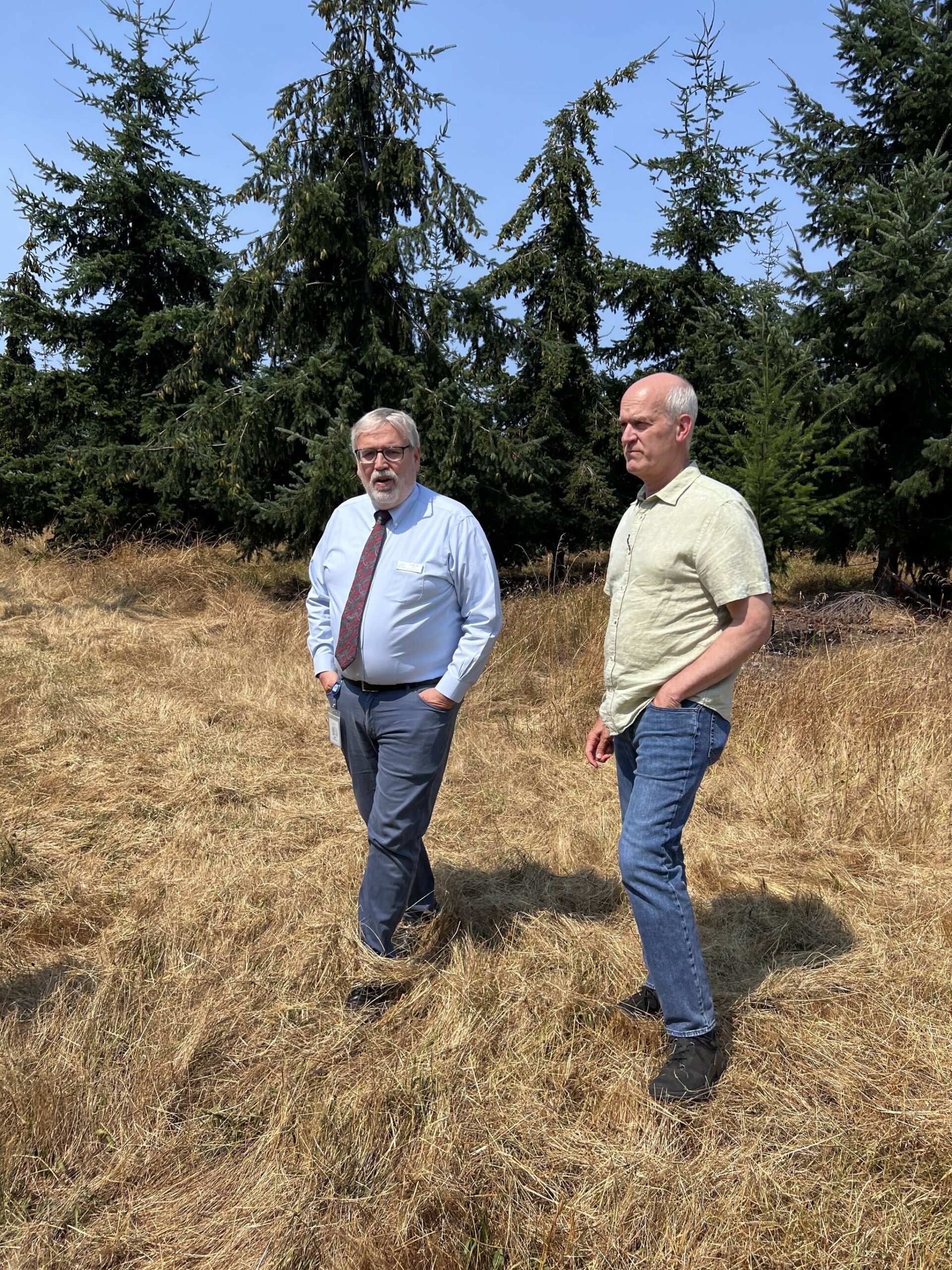 Island Transit Acting Director Craig Cyr (left) and U.S. Rep. Rick Larsen tour the Seed Tree Farm adjacent to the Coupeville operating base where they are looking at expansion. (Photo provided)