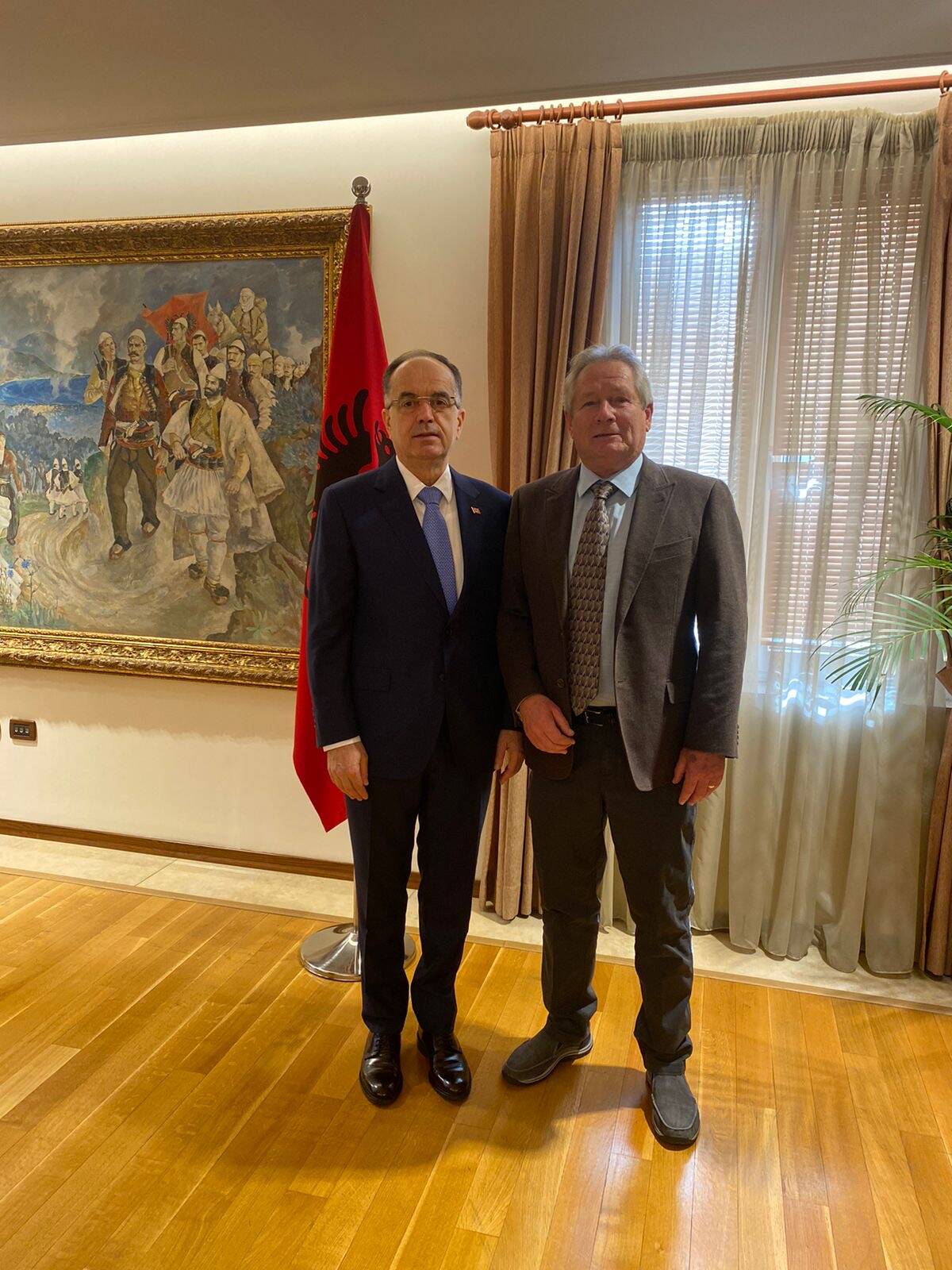 Bernd Fischer, at right, stands with with Albanian President Bajram Begaj.