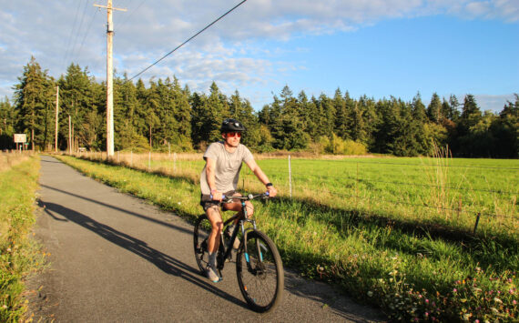 Photo by Luisa Loi
Oak Harbor resident Patrick Hanlon rides a bike on the Rhododendron Trail near Coupeville.