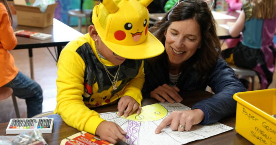 Superintendent Michelle Kuss-Cybula helps a student.