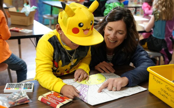 Superintendent Michelle Kuss-Cybula helps a student.