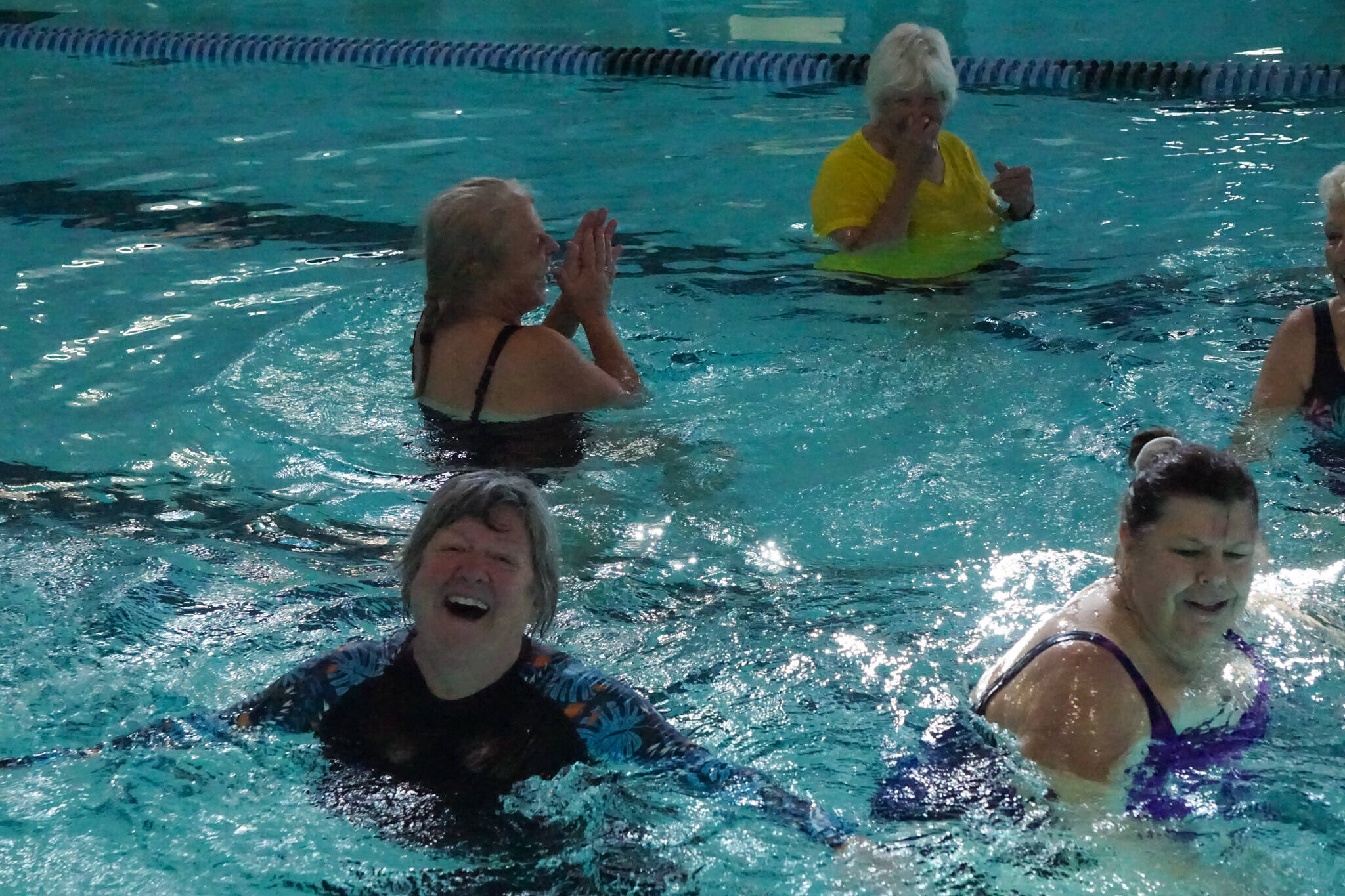 Photo by Sam Fletcher
Brenda Haworth smiles while playing volleyball at the John Vanderzicht Memorial Pool Monday morning.