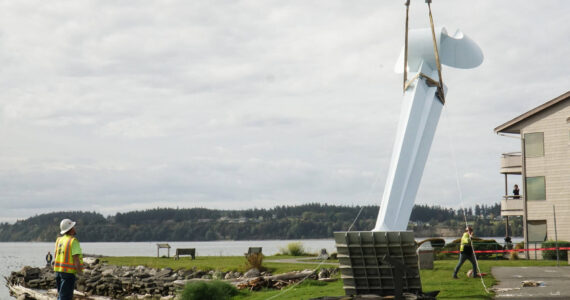 Ram Construction staff hoist the horizontal Angel De Creatividad sculpture upright on Wednesday. (Photo by Sam Fletcher)