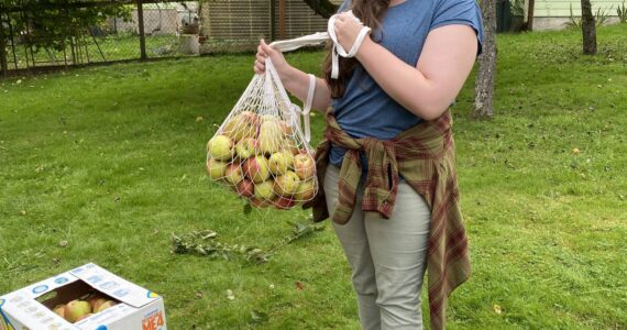 Photo provided
Woodhaven junior Maggie Hogan holds a bag of apples.