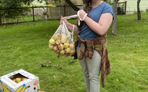 Photo provided
Woodhaven junior Maggie Hogan holds a bag of apples.