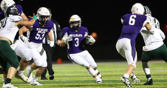 Photo by John Fisken
Oak Harbor’s Jayson Champignon runs with the ball during the Wildcats 49-21 victory Oct. 11 against Mount Vernon. Oak Harbor has an overall record of 6-1 and wraps up their regular season Friday hosting North Kitsap.