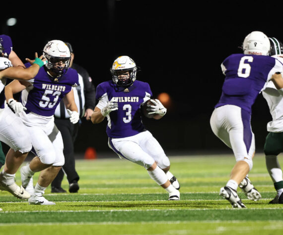 Photo by John Fisken
Oak Harbor’s Jayson Champignon runs with the ball during the Wildcats 49-21 victory Oct. 11 against Mount Vernon. Oak Harbor has an overall record of 6-1 and wraps up their regular season Friday hosting North Kitsap.