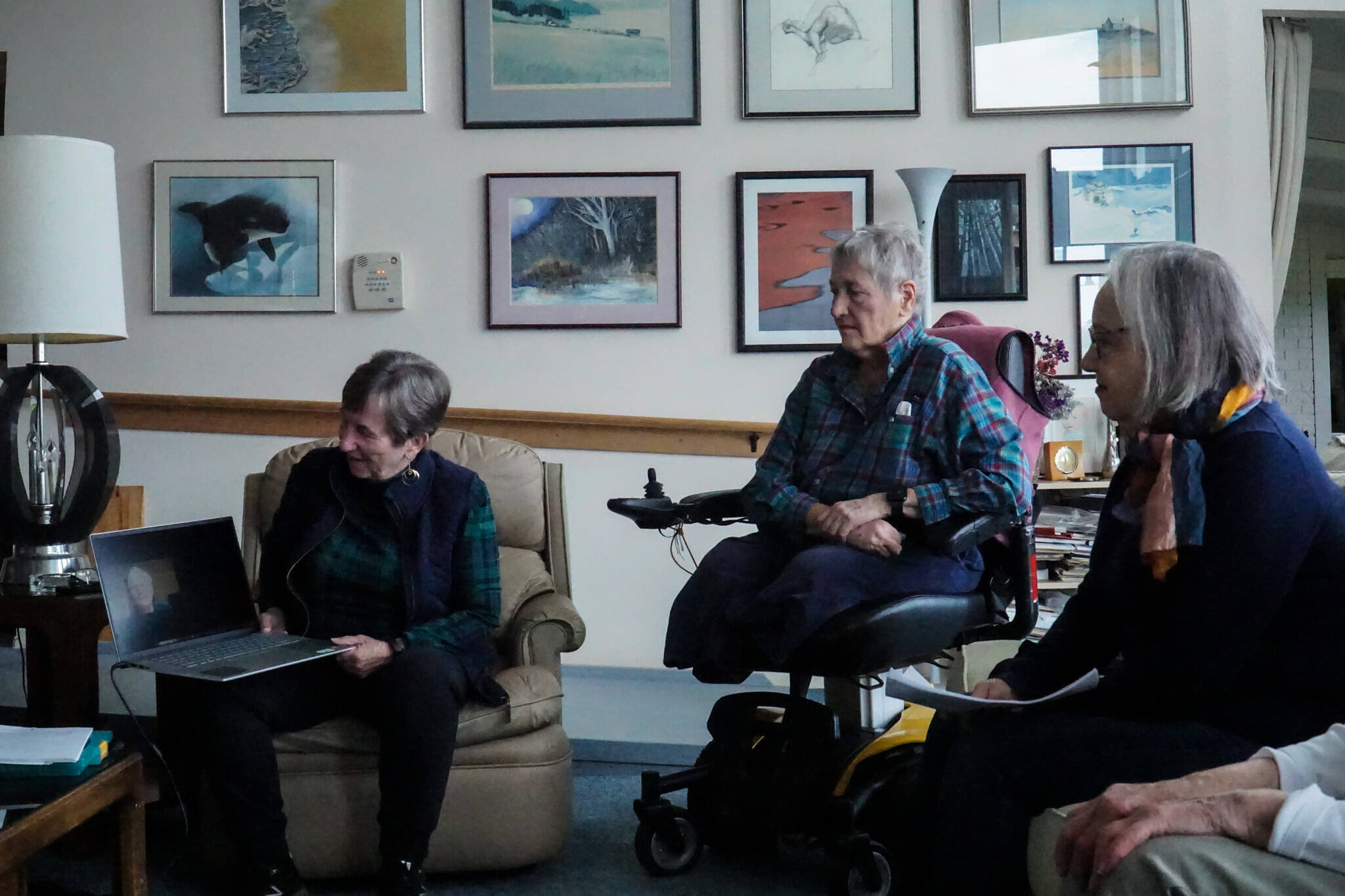 Whidbey Writers Group members (from left): Jan Wright, Barb Bland and Miriam Johnston chat with Bill Wilson over Zoom. (Photo by Sam Fletcher)