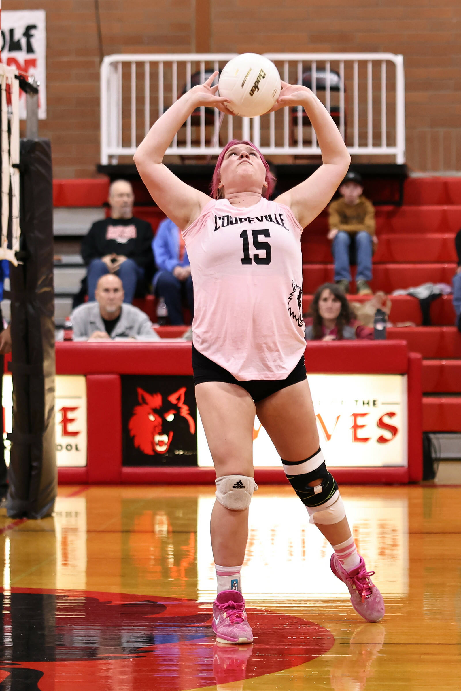 (Photo by John Fisken)
Katie Marti flicks a pass skyward.