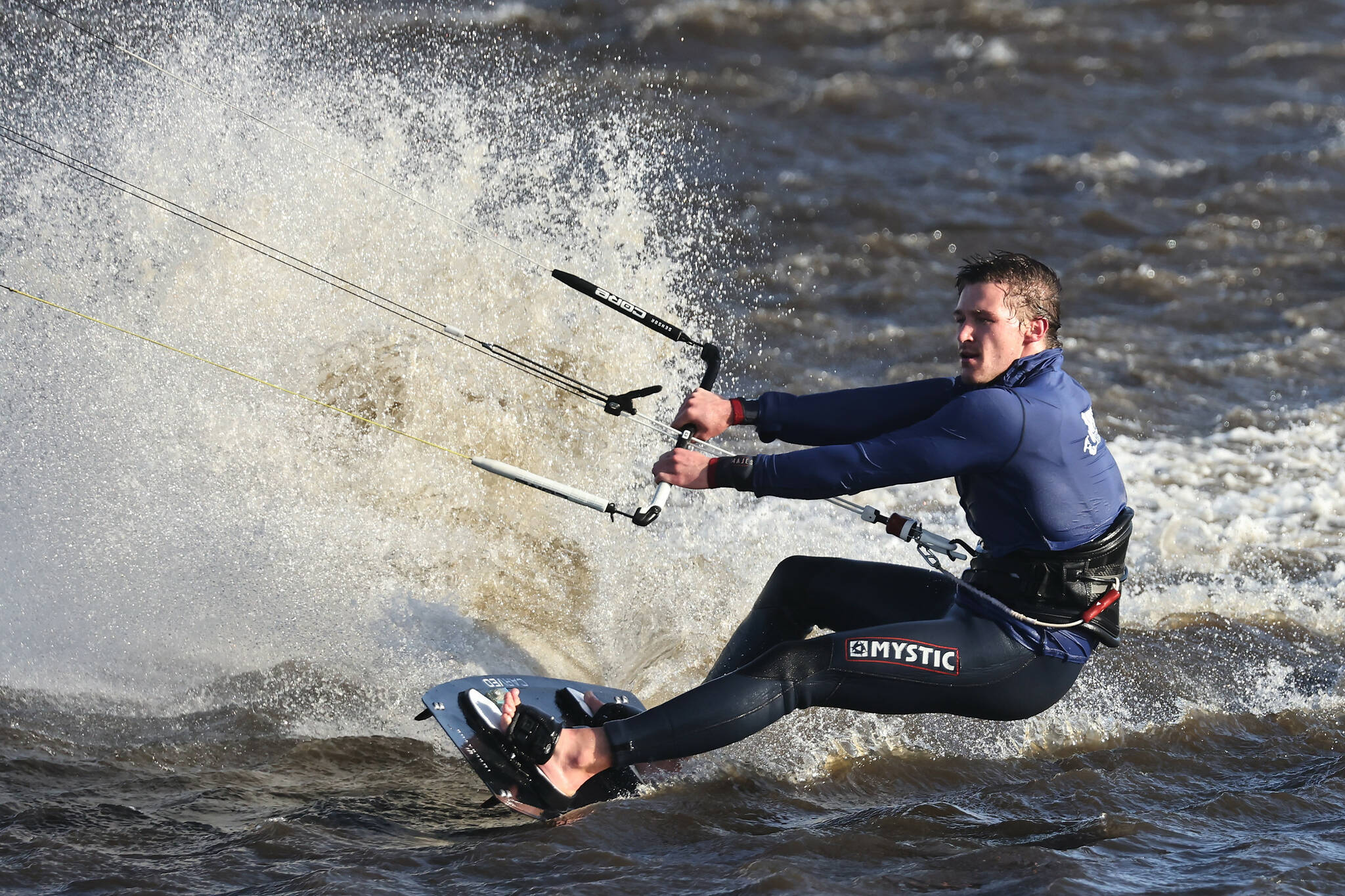 (Photo by John Fisken)
A kitesurfer takes advantage of the windy weather on Whidbey to catch waves on Swan Lake Monday.