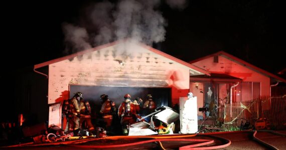 Oak Harbor Fire Department, North Whidbey Fire and Rescue and Naval Air Station Whidbey Island Fire Department responded to a residential fire on Northwest Illahee Drive Tuesday night. (Photo by John Fisken)