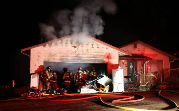 Oak Harbor Fire Department, North Whidbey Fire and Rescue and Naval Air Station Whidbey Island Fire Department responded to a residential fire on Northwest Illahee Drive Tuesday night. (Photo by John Fisken)