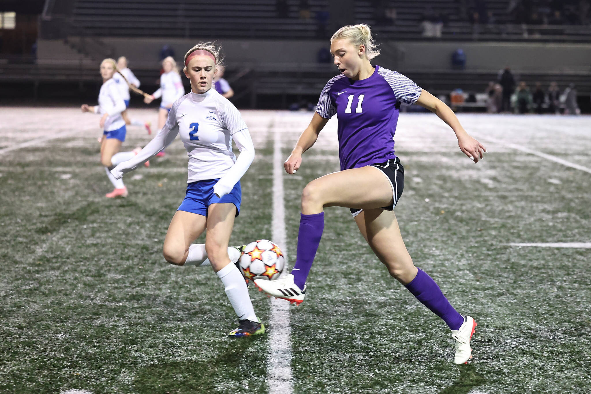 (Photo by John Fisken)
Oak Harbor’s Addisen Boyer maneuvers the ball past a Sedro-Woolley defender during a district playoff game Tuesday against Sedro-Woolley where Boyer topped 100 career goals.