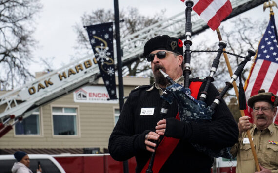 Photo by Sam Fletcher
Don Scoby, commander of Scottish American Military Society Pig War Post 1859, plays the bagpipe at the Veterans Day Parade in Oak Harbor.