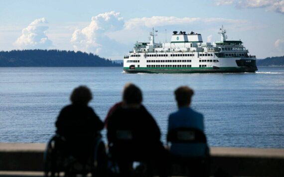 A ferry heads out from Mukilteo toward Clinton during the evening commute in 2022. (Ryan Berry / The Everett Herald)