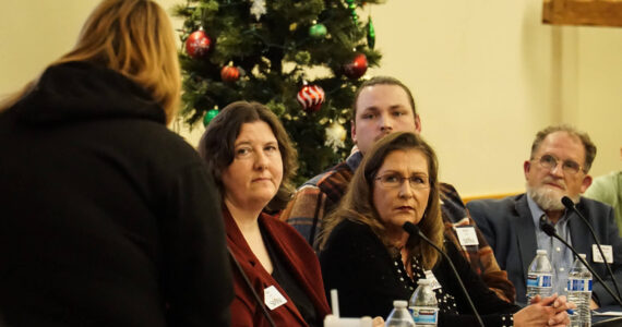 SPiN Cafe board members Valerie Roseberry, Michele Hines, Mark Stroud and David Thorns listen to a comment from Jamie Sherwin at a town hall meeting Wednesday night. (Photo by Sam Fletcher)