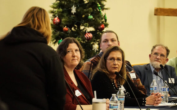 SPiN Cafe board members Valerie Roseberry, Michele Hines, Mark Stroud and David Thorns listen to a comment from Jamie Sherwin at a town hall meeting Wednesday night. (Photo by Sam Fletcher)