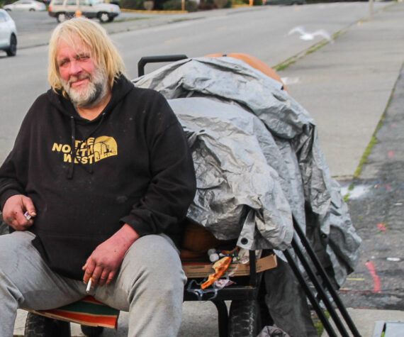 <p>(Photo by Luisa Loi/Whidbey News-Times)</p>
                                <p>Jeff Pangburn, 55, sits on his cart on Southwest Barlow Street in Oak Harbor.</p>