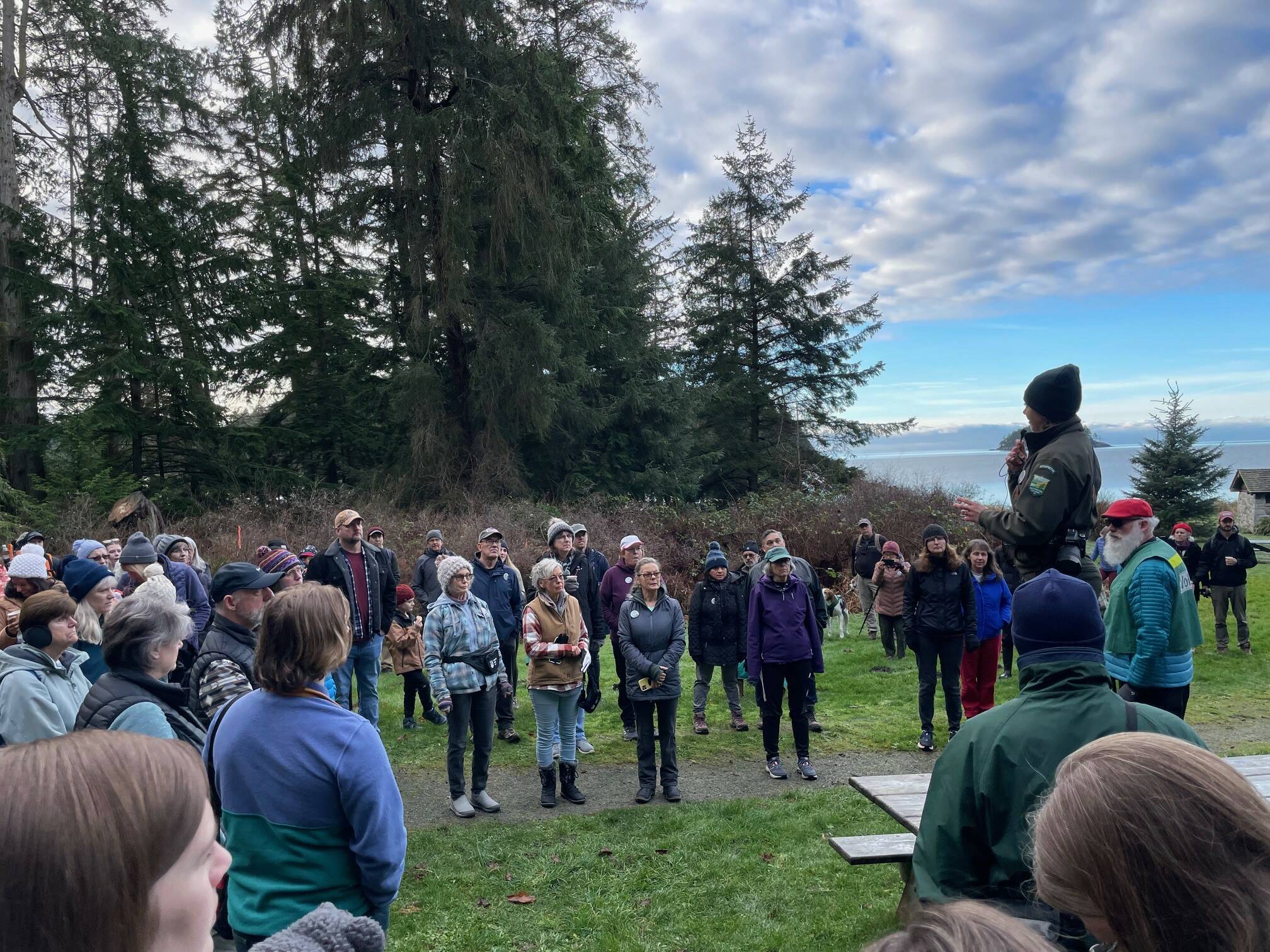 (Photo provided) Interpretive Specialist, Joy Sullivan, welcomes First Day Hike attendees at Bowman Bay on Jan. 1, 2024.