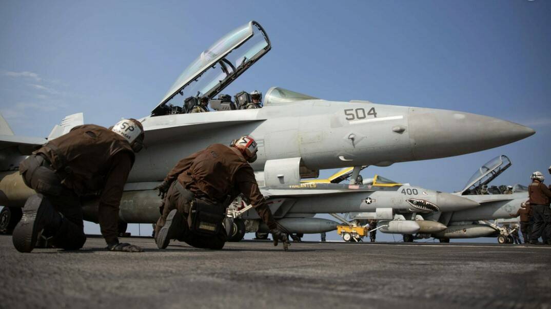 Courtesy Photo
Sailors conduct a pre-flight check on an EA-18G Growler, attached to Electronic Attack Squadron (VAQ) 133, on the flight deck of the Nimitz-class aircraft carrier USS Abraham Lincoln (CVN 72).