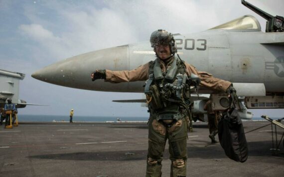 A U.S. Navy officer, assigned to Strike Fighter Squadron (VFA) 14, celebrates a change of command aboard the Nimitz-class aircraft carrier USS Abraham Lincoln (CVN 72). (Courtesy photo)