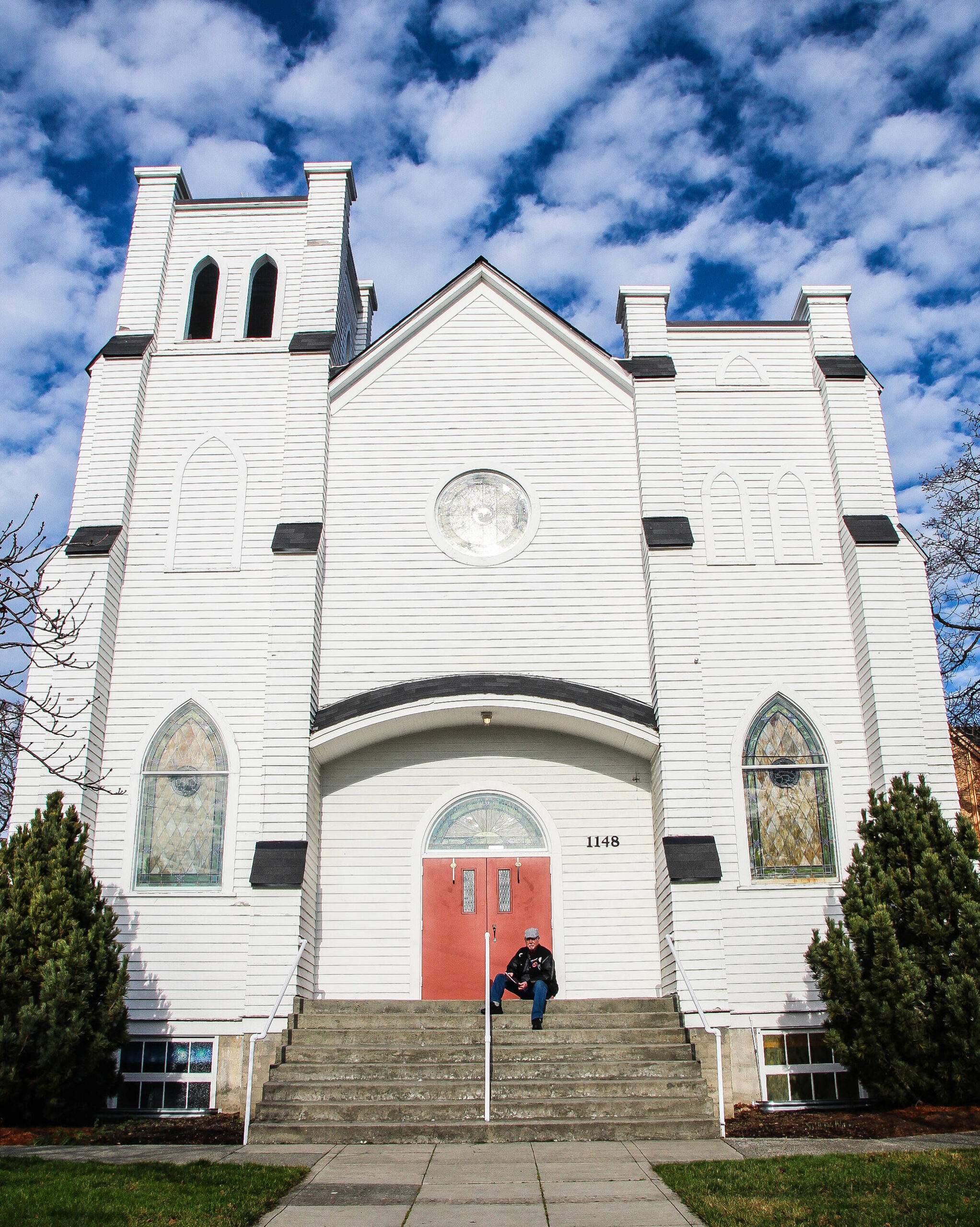 (Photo by Luisa Loi)
Bill Waite sits in front of the Whidbey Presbyterian Church’s 96-year-old building.